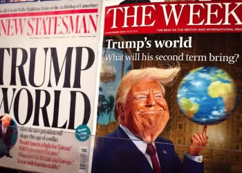 Trump magazine and newspaper covers on a news stand in London.
