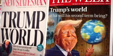 Trump magazine and newspaper covers on a news stand in London.