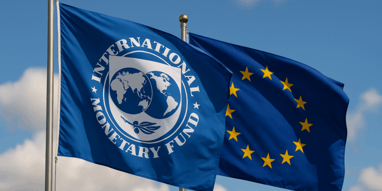Flags of the IMF and the EU against a blue sky background.
