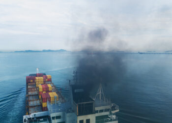 Container Ship Emitting Black Smoke in the Ocean