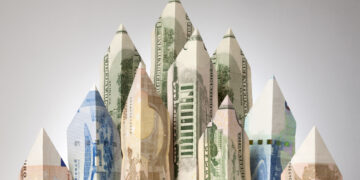 Skyscrapers made of paper currency.